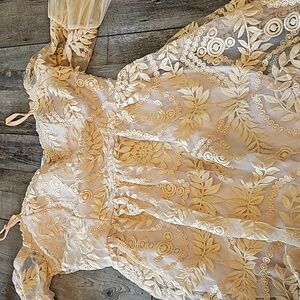 A. Peach. Size Small dress. Off white, lace. Short dress. Has a built in bra.